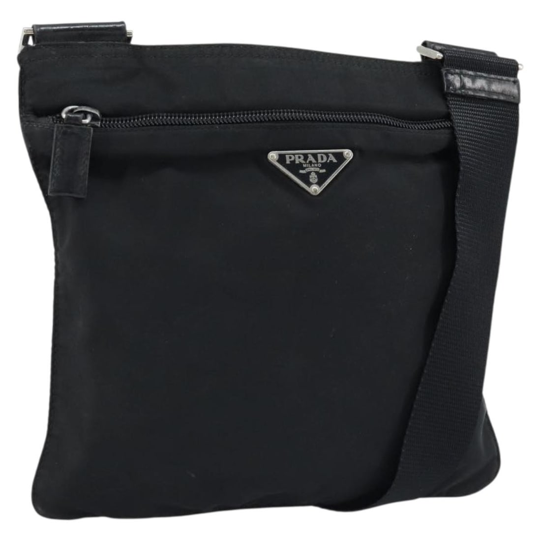 PRADA Black Nylon Shoulder Bag Silver Tone Italy: PRADA Black Nylon Shoulder Bag Silver Tone Italy This Prada shoulder bag is made of black nylon with silver-tone exterior details and was made in Italy. It features a shoulder strap with an adjustable