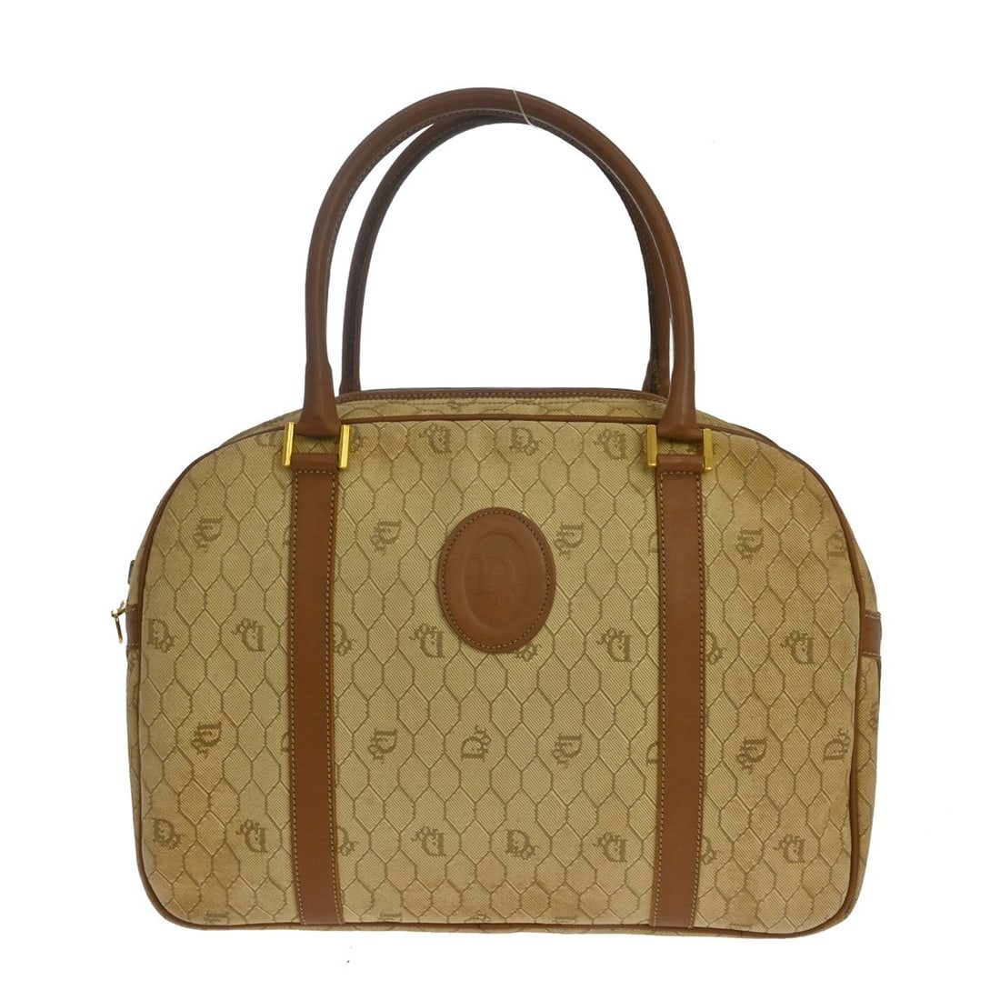 Vintage Dior satchel in beige canvas and leather: Vintage Dior satchel in beige canvas and leather Vintage Christian Dior satchel/top handle handbag in beige canvas and leather with brown handles and zip closure. The bag features two interior pockets