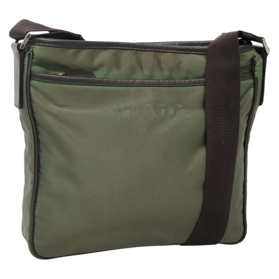 PRADA Khaki Nylon Shoulder Bag with Silver Accents BA3657: PRADA Khaki Nylon Shoulder Bag with Silver Accents BA3657 This PRADA shoulder bag combines style and functionality, crafted from durable nylon in a sophisticated khaki and silver color scheme. With di