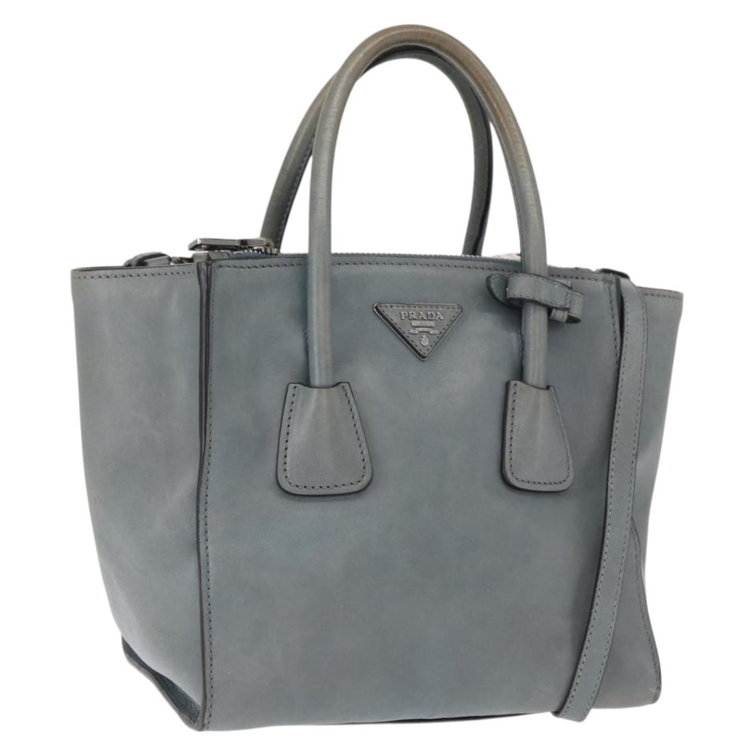 PRADA Saffiano Leather 2 Way Handbag Gray Silver with Shoulder Strap: PRADA Saffiano Leather 2 Way Handbag Gray Silver with Shoulder Strap Prada 2-way handbag in gray/silver Saffiano leather, offered with a shoulder strap. It features a structured style and shows heavy 