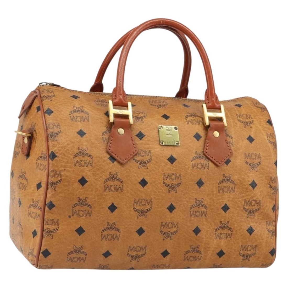 MCM Vicetos Brown Gold PVC Leather Handbag Germany Auth: MCM Vicetos Brown Gold PVC Leather Handbag Germany Auth This MCM Vicetos Logogram handbag features a brown and gold PVC leather exterior with gold-tone accents. The bag has a structured silhouette wit