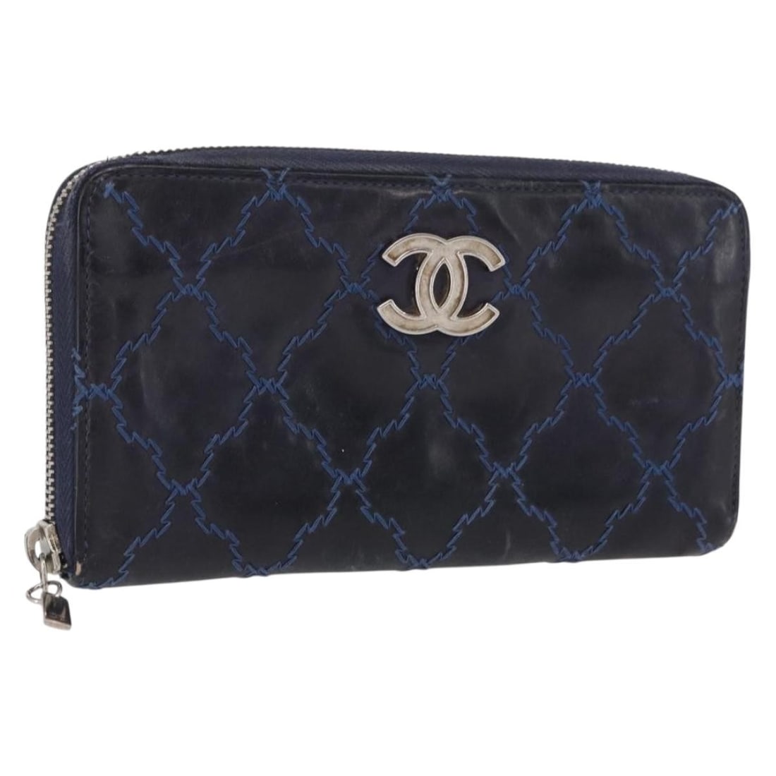 Navy Leather Matelasse Long Wallet by CHANEL with Silver CC Logo: Navy Leather Matelasse Long Wallet by CHANEL with Silver CC Logo This CHANEL Matelasse long wallet is crafted from navy leather with silver-tone CC accents. Designed for women, it features a spacious 