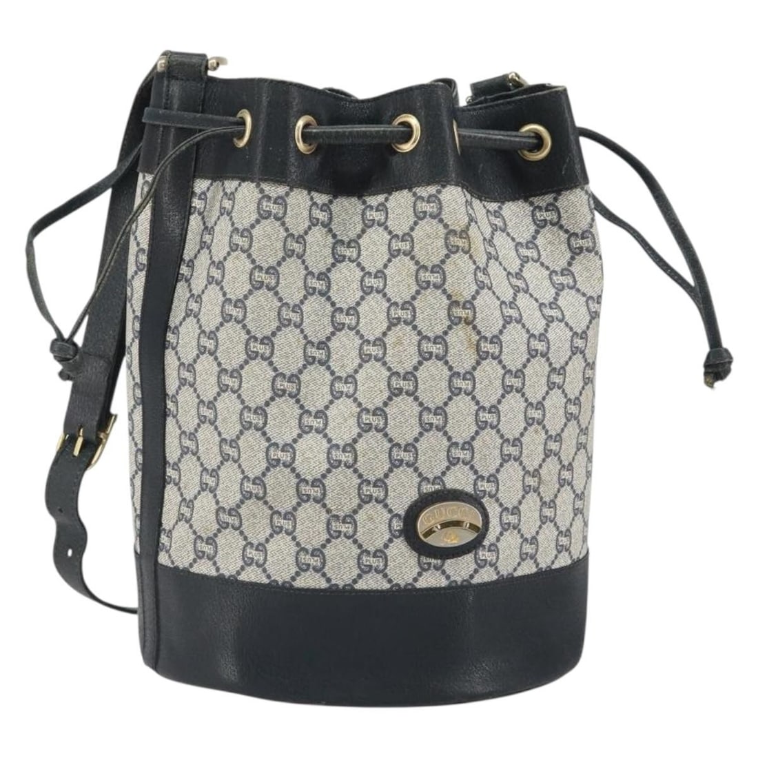 GG Supreme Navy PVC Leather Shoulder Bag by Gucci: GG Supreme Navy PVC Leather Shoulder Bag by Gucci This GUCCI GG Plus Supreme shoulder bag is crafted from PVC leather and GG canvas in navy and gold tones. Designed for women, it features a spacious i