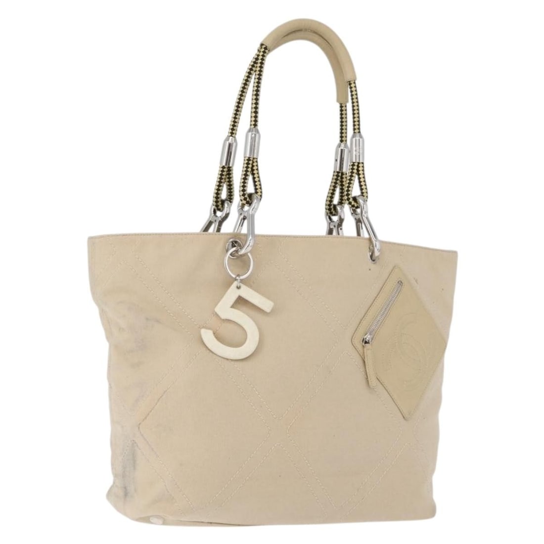 Chanel No5 Beige Canvas Tote Bag with Silver CC Charm: Chanel No5 Beige Canvas Tote Bag with Silver CC Charm Beige and silver CHANEL tote bag in canvas, made in Italy. It includes a charm accessory and measures approximately 31 cm wide x 28 cm high x 11 c