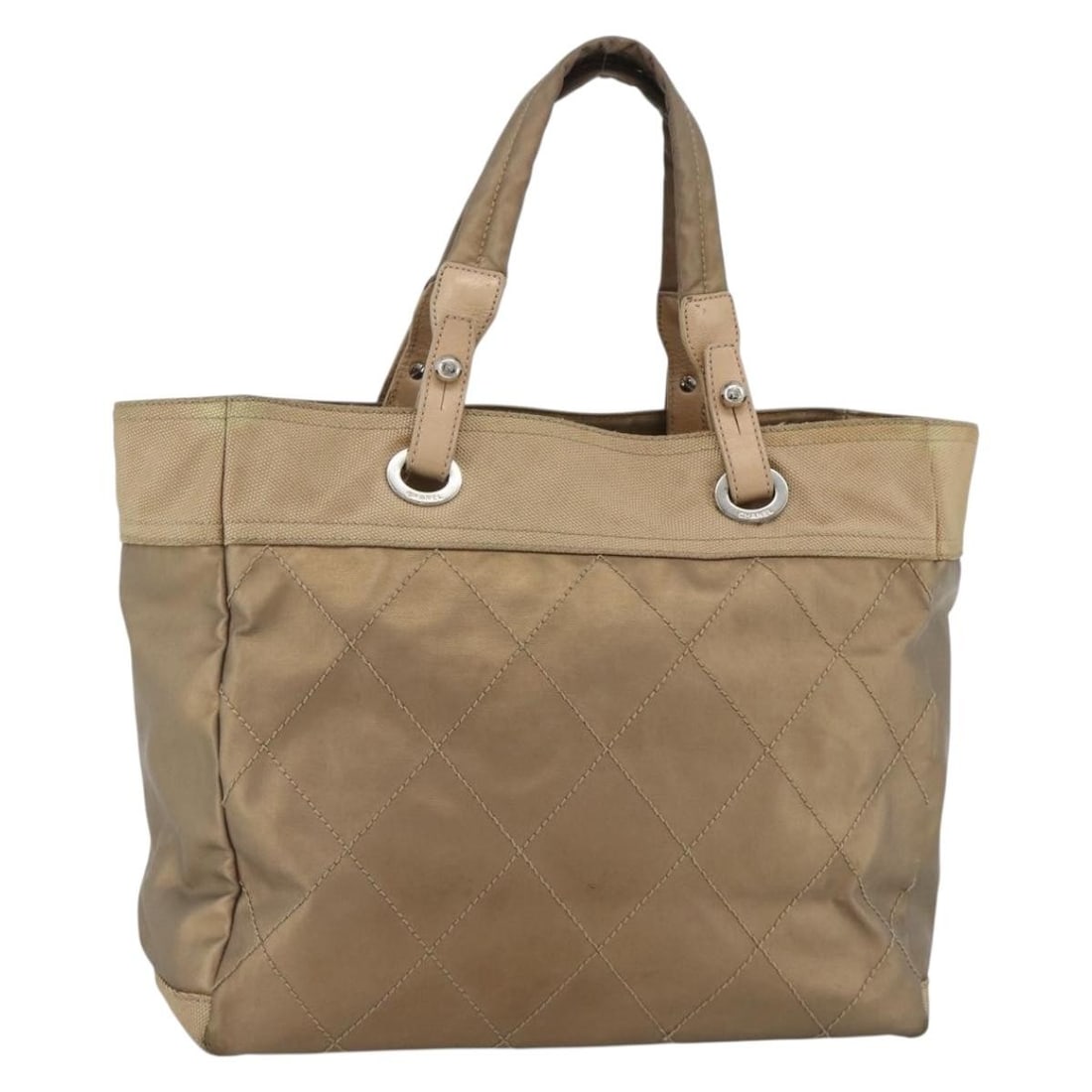 CHANEL Paris Biarritz GM Coated Canvas Tote Gold Silver: CHANEL Paris Biarritz GM Coated Canvas Tote Gold Silver A CHANEL Paris Biarritz GM tote bag in coated canvas with a gold and silver colorway. Made in Italy, this bag features a spacious tote silhouett