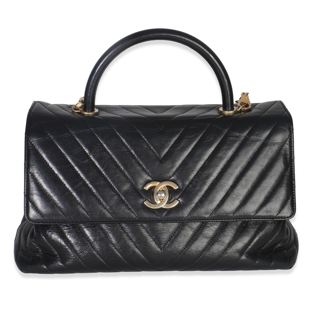 Chanel Large Coco Top Handle Bag Black Leather Chevron Pattern: Chanel Large Coco Top Handle Bag Black Leather Chevron Pattern Black chevron aged calfskin handbag in a large top handle style with a turnlock closure. It features a fabric lining in red, gold-tone ha