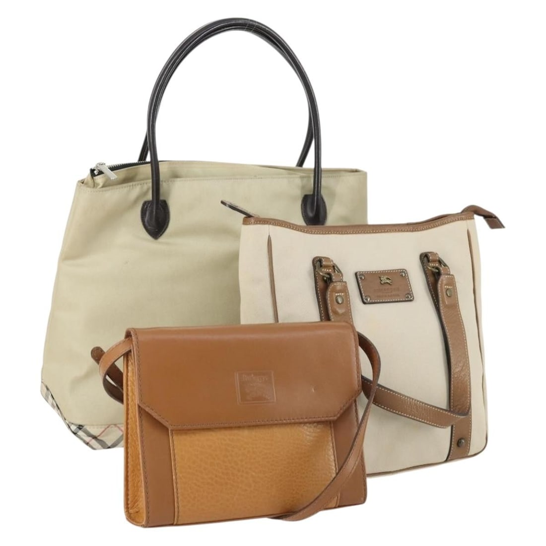 Set of Three Beige Brown Burberry Nylon Canvas and Leather Tote Bags: Set of Three Beige Brown Burberry Nylon Canvas and Leather Tote Bags This is a BURBERRY tote bag set featuring three pieces crafted from beige and brown nylon canvas with leather accents. The bags sho