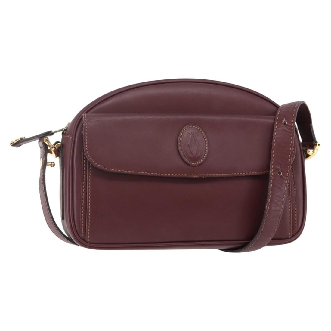 CARTIER Must Line Bordeaux Leather Shoulder Bag with Guarantee Card: CARTIER Must Line Bordeaux Leather Shoulder Bag with Guarantee Card Introducing the CARTIER Must Line Shoulder Bag, a sophisticated accessory crafted from high-quality leather in a rich bordeaux hue. 