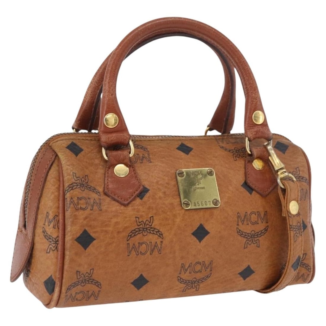 MCM Vicetos Mini Boston Bag Brown Gold PVC Leather 2way: MCM Vicetos Mini Boston Bag Brown Gold PVC Leather 2way This MCM Vicetos Mini Logogram Boston Bag is crafted from brown and gold PVC leather and features the brand's signature logogram design. The bag