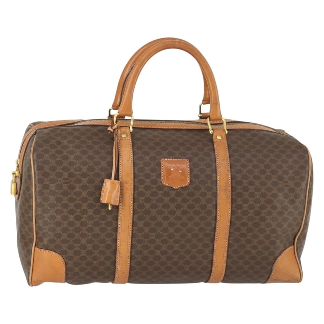 CELINE Macadam Boston Bag Brown PVC Leather Canvas with Padlock Keys: CELINE Macadam Boston Bag Brown PVC Leather Canvas with Padlock Keys A CELINE Boston bag in brown and gold, crafted from PVC leather and Macadam canvas. It features a padlock, two keys, and a clochett