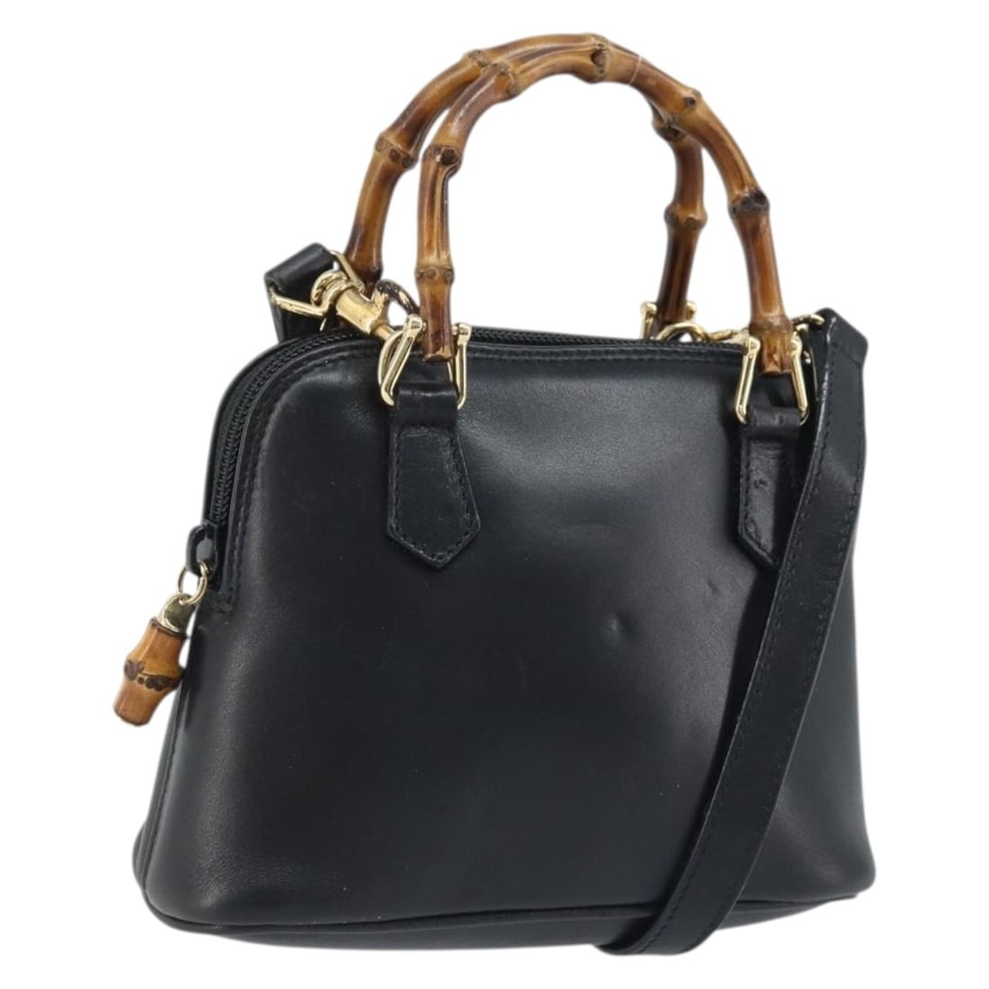 Black Leather Bamboo Handle Shoulder Bag by Gucci with Gold Hardware: Black Leather Bamboo Handle Shoulder Bag by Gucci with Gold Hardware This GUCCI Bamboo handbag features black leather with gold-tone accents and offers both hand and shoulder carry options with its de