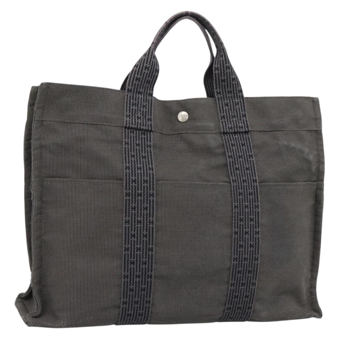 Hermes Her Line MM Canvas Handbag Gray Silver France: Hermes Her Line MM Canvas Handbag Gray Silver France Hermes Her Line MM hand bag in gray/silver canvas, made in France. This women's bag features a handle drop of approximately 4.3 inches (11 cm) and 