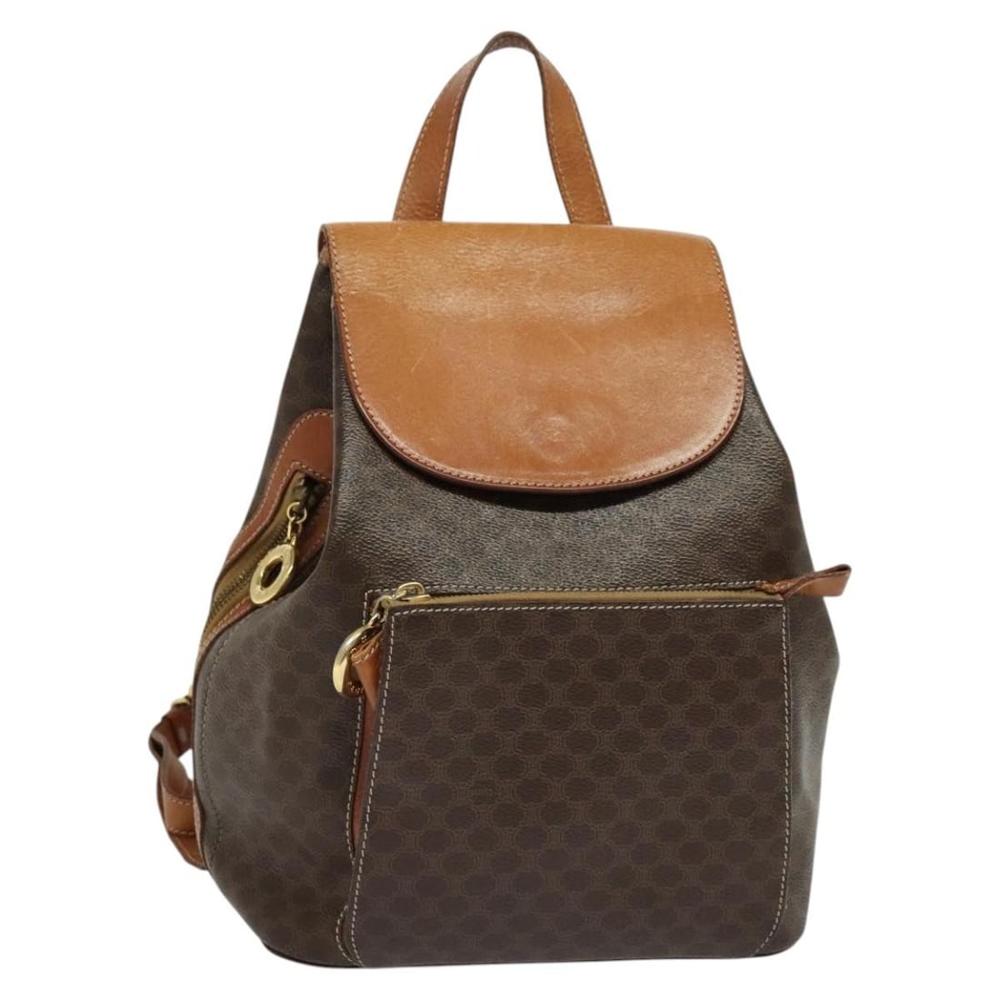 CELINE Brown PVC Leather Backpack with Shoulder Strap Made in Italy: CELINE Brown PVC Leather Backpack with Shoulder Strap Made in Italy CELINE backpack in brown and gold PVC leather, made in Italy. It measures approximately 9.1 x 11.8 x 6.3 inches (W x H x D) and come