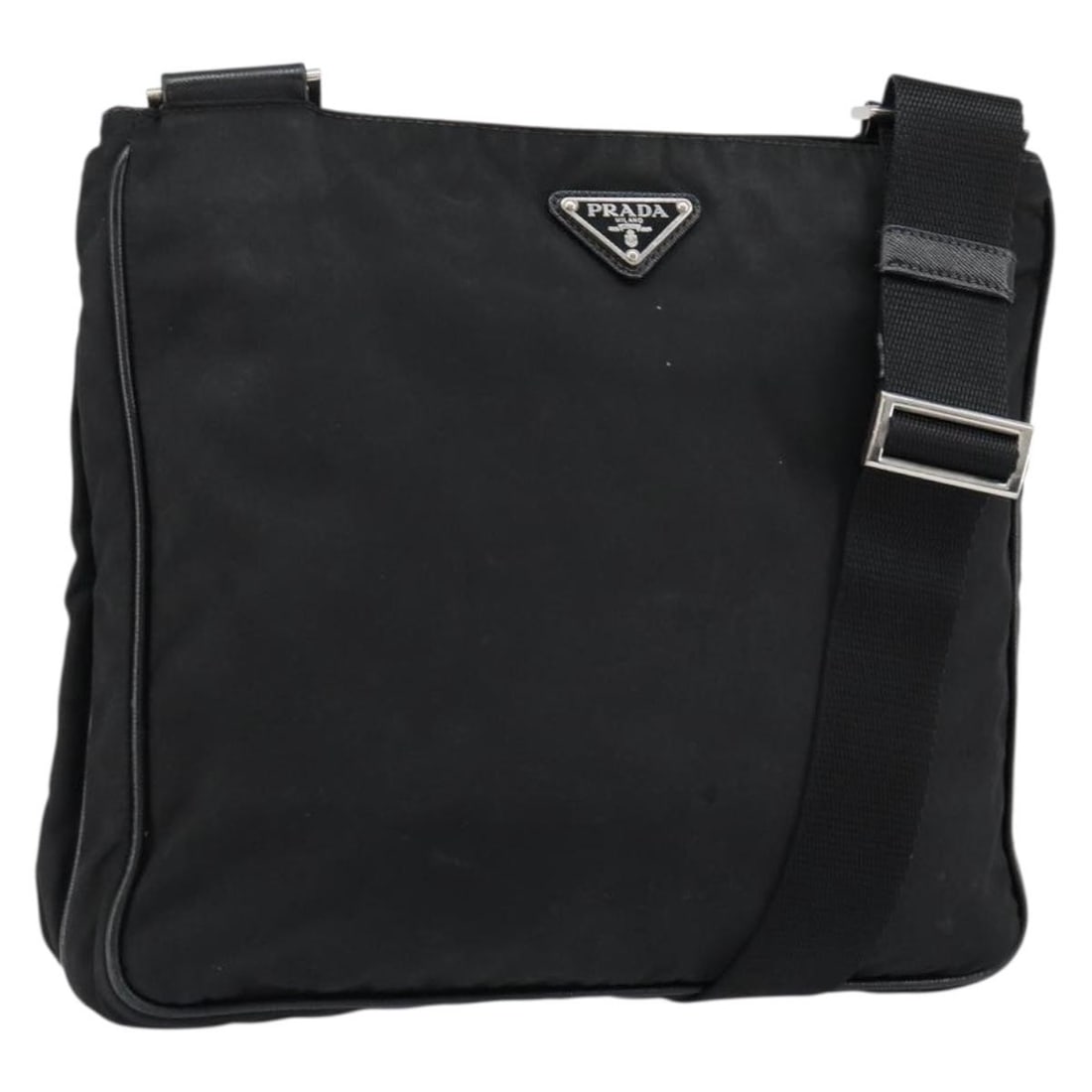 Prada Nylon Black Silver Shoulder Bag Italy: Prada Nylon Black Silver Shoulder Bag Italy This PRADA shoulder bag is crafted from black nylon with silver-tone accents. Designed for women, it features an adjustable shoulder strap and offers a spac
