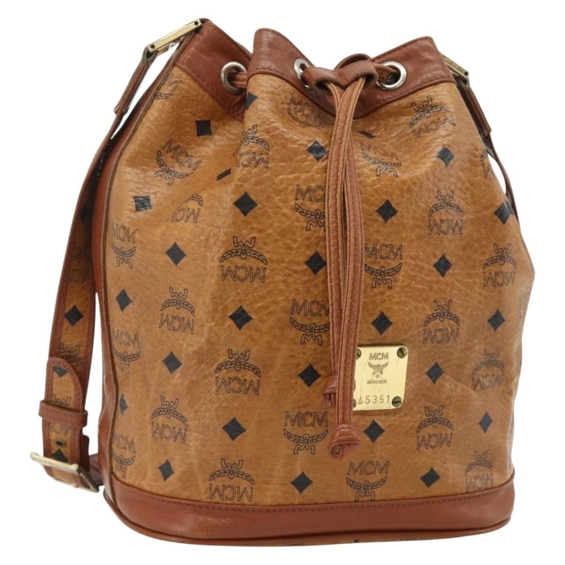 MCM Vicetos Logogram Shoulder Bag Drawstring PVC Leather Brown Gold: MCM Vicetos Logogram Shoulder Bag Drawstring PVC Leather Brown Gold MCM Vicetos logogram drawstring shoulder bag in brown and gold PVC leather. This women's bag is made in Germany and features a draws