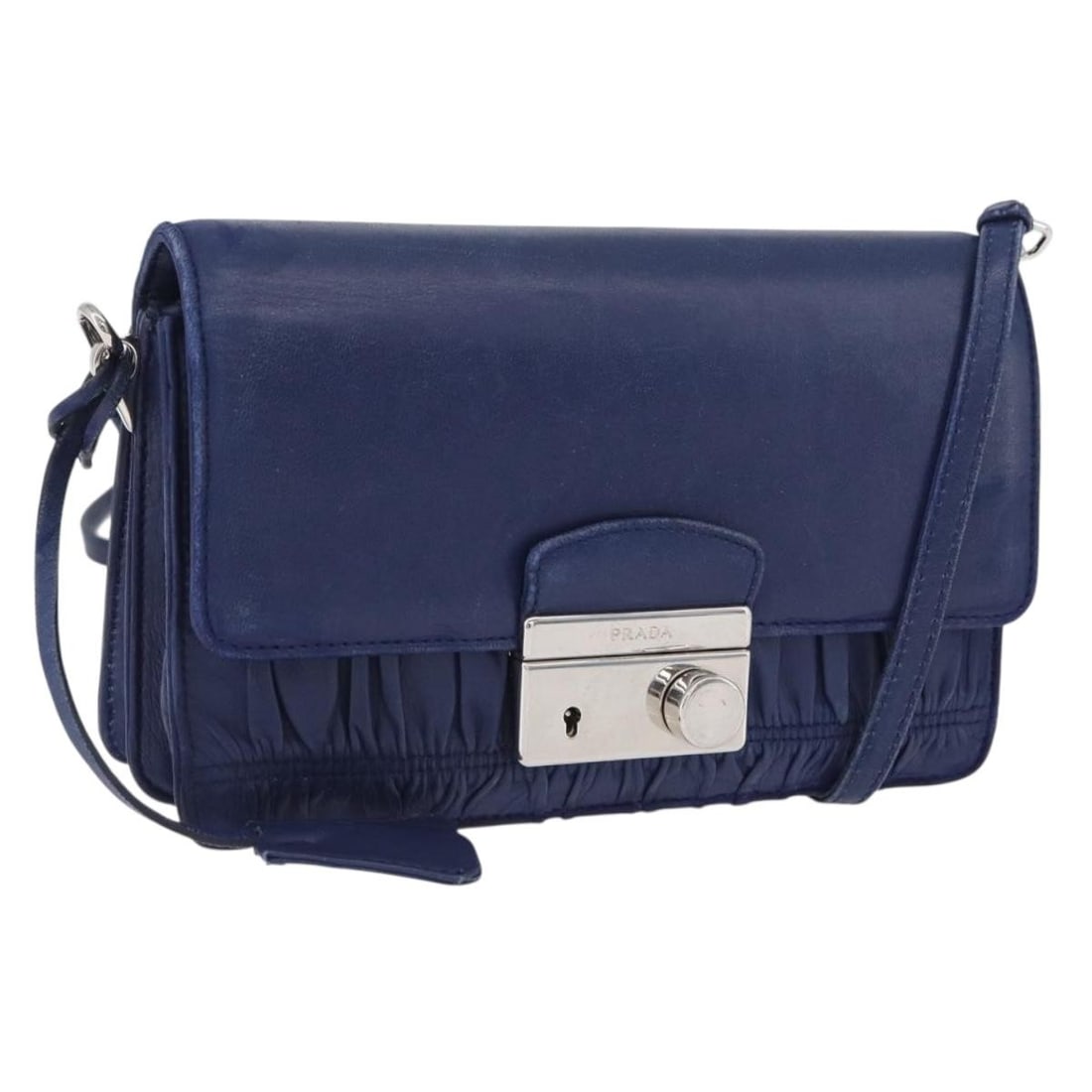 Prada Blue Leather Shoulder Purse with Silver Accents and Dust Bag: Prada Blue Leather Shoulder Purse with Silver Accents and Dust Bag This PRADA shoulder bag is crafted from blue and silver leather and is designed for women. Made in Italy, it features a compact silho