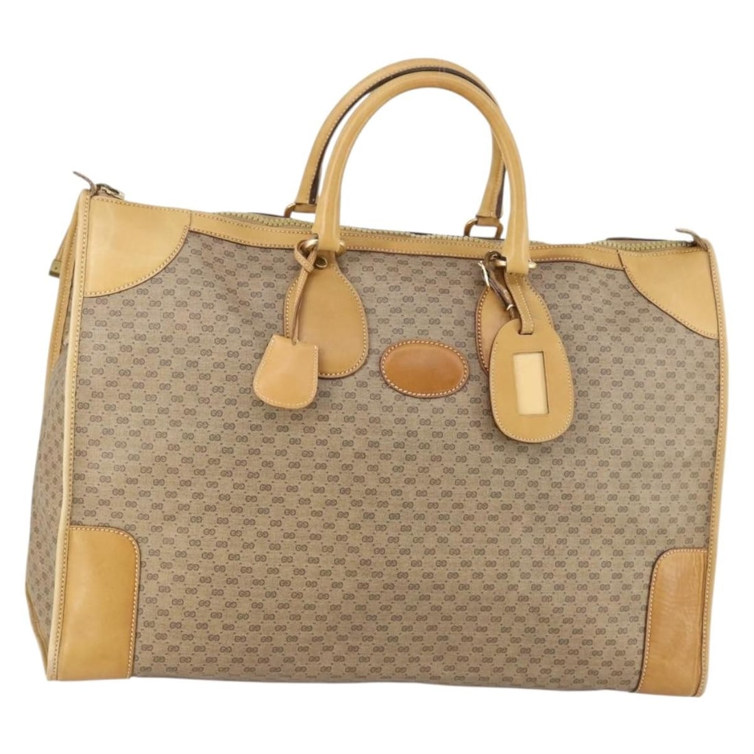 GUCCI Vintage Beige Gold Micro GG Supreme PVC Leather Hand Bag: GUCCI Vintage Beige Gold Micro GG Supreme PVC Leather Hand Bag A vintage Gucci hand bag in beige and gold, made from PVC leather and Micro Small GG canvas. It includes a name tag accessory and was mad