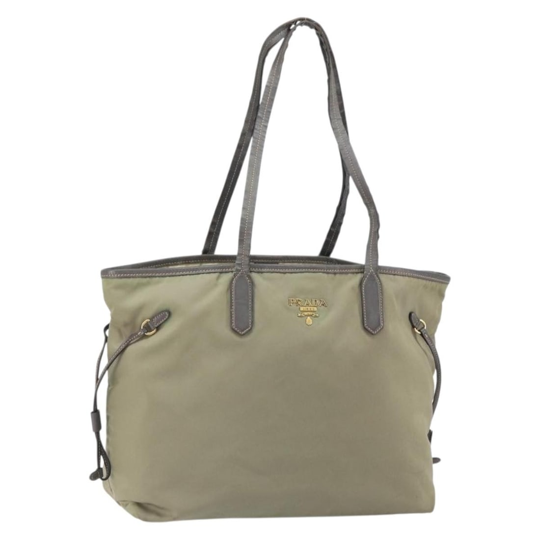 PRADA Beige Gold Nylon Tote Bag Italy: PRADA Beige Gold Nylon Tote Bag Italy This PRADA tote bag is crafted from beige nylon with gold-tone accents and is designed for women. Made in Italy, the bag features a spacious interior and practica