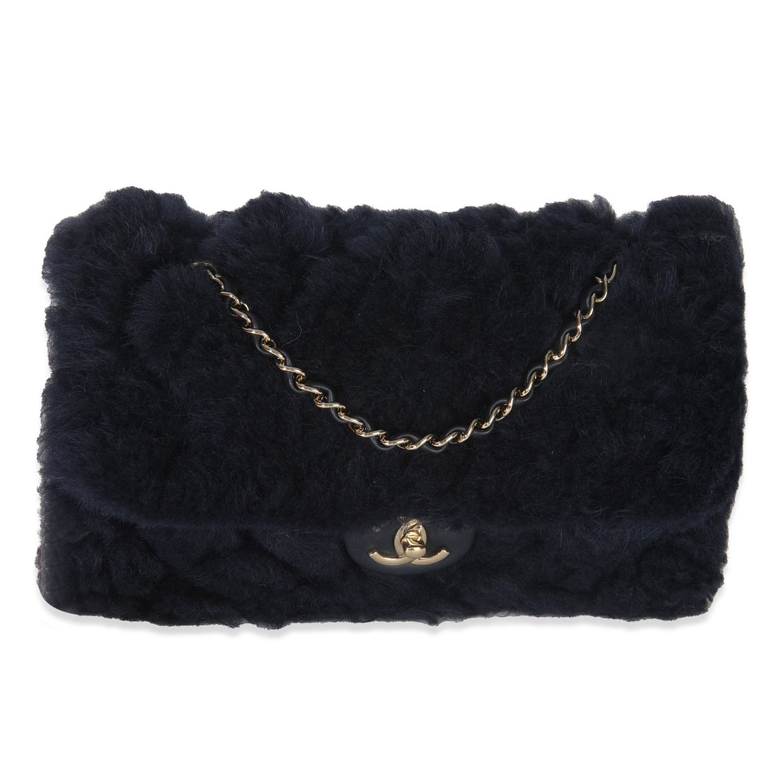 Chanel Medium Flap Bag Navy Shearling Quilted Lambskin Shoulder Bag: Chanel Medium Flap Bag Navy Shearling Quilted Lambskin Shoulder Bag A pre-owned medium flap shoulder bag in navy shearling quilted lambskin with a turnlock closure and gold-tone hardware. The bag feat