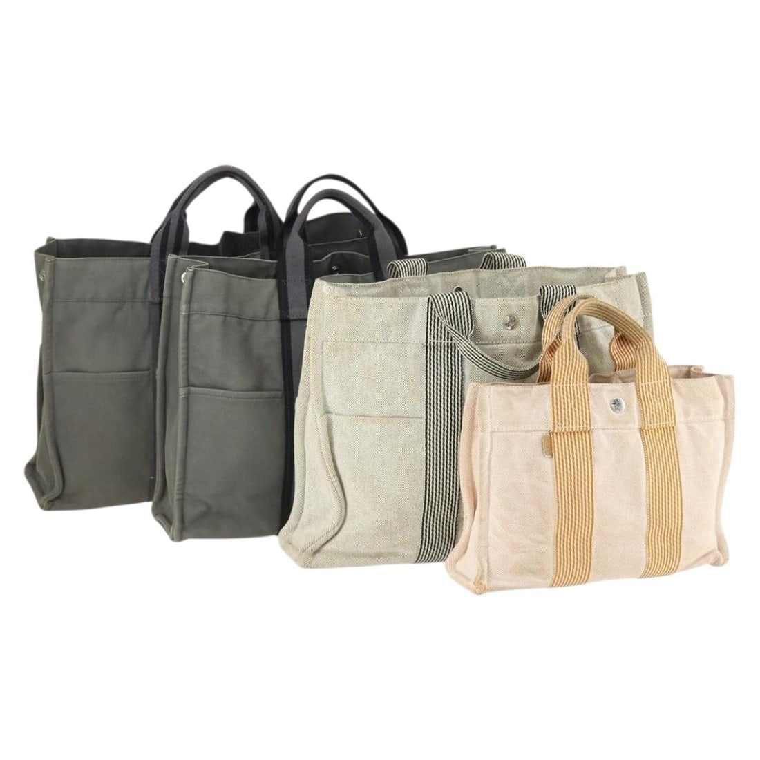 Set of 4 Hermes Fourre Tout Canvas Handbags Gray Beige: Set of 4 Hermes Fourre Tout Canvas Handbags Gray Beige This set includes four Hermes Fourre Tout handbags crafted from cotton canvas in a gray and beige color scheme. Made in France, these handbags sh