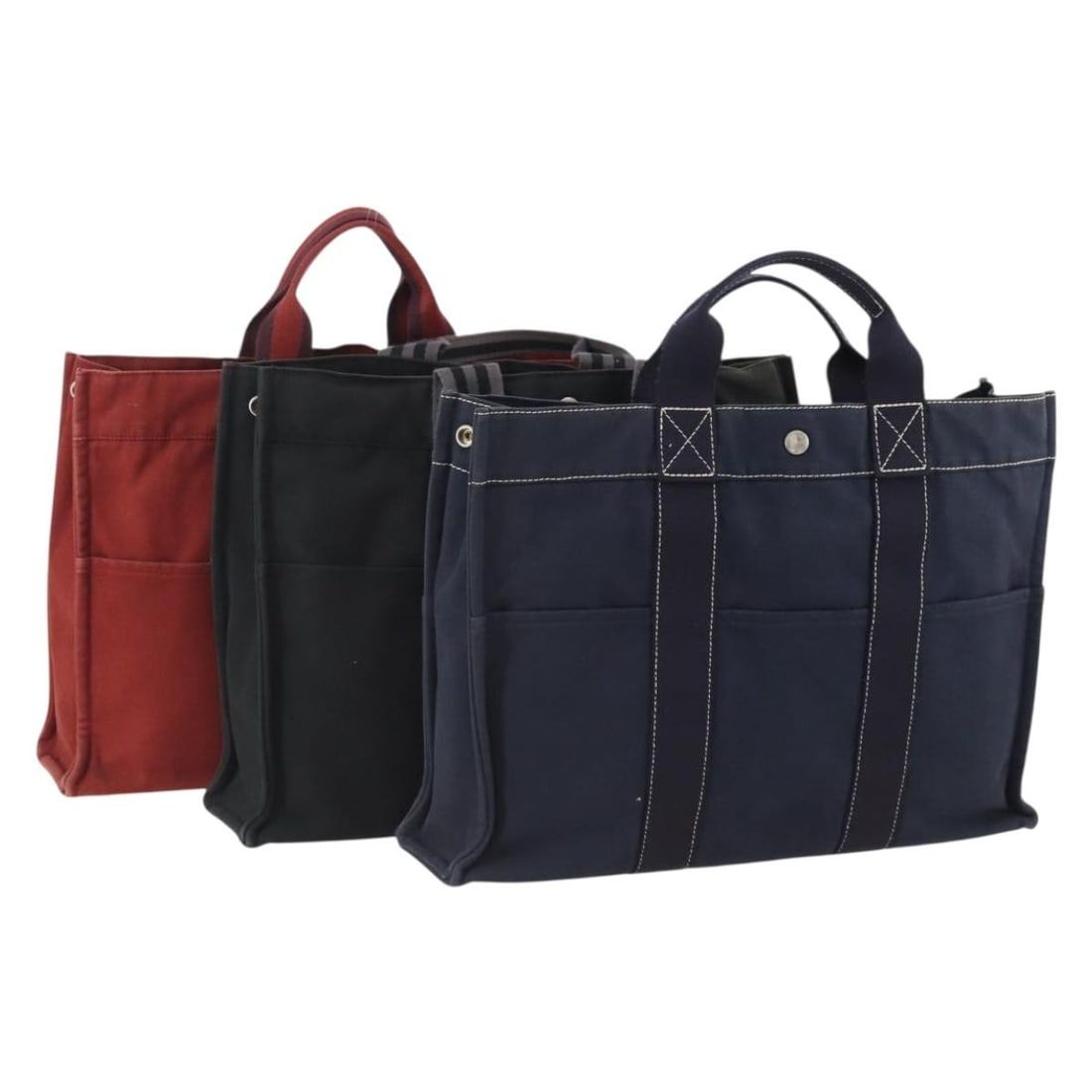 3 Hermes Fourre Tout MM Canvas Handbags Navy Black Red: 3 Hermes Fourre Tout MM Canvas Handbags Navy Black Red Hermes Fourre Tout MM hand bag in canvas, presented as a 3-set in navy, black, and red. Made in France, this women's handbag measures approximate