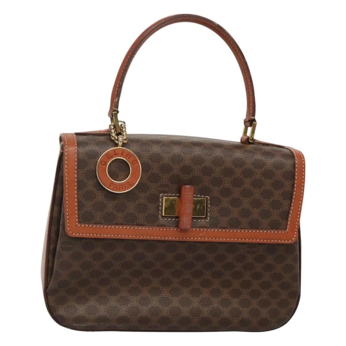 CELINE Macadam Canvas PVC Leather Handbag Brown Gold Tone: CELINE Macadam Canvas PVC Leather Handbag Brown Gold Tone This CELINE Macadam canvas hand bag is crafted in PVC leather with a brown and gold color scheme. It features a structured silhouette, handle 