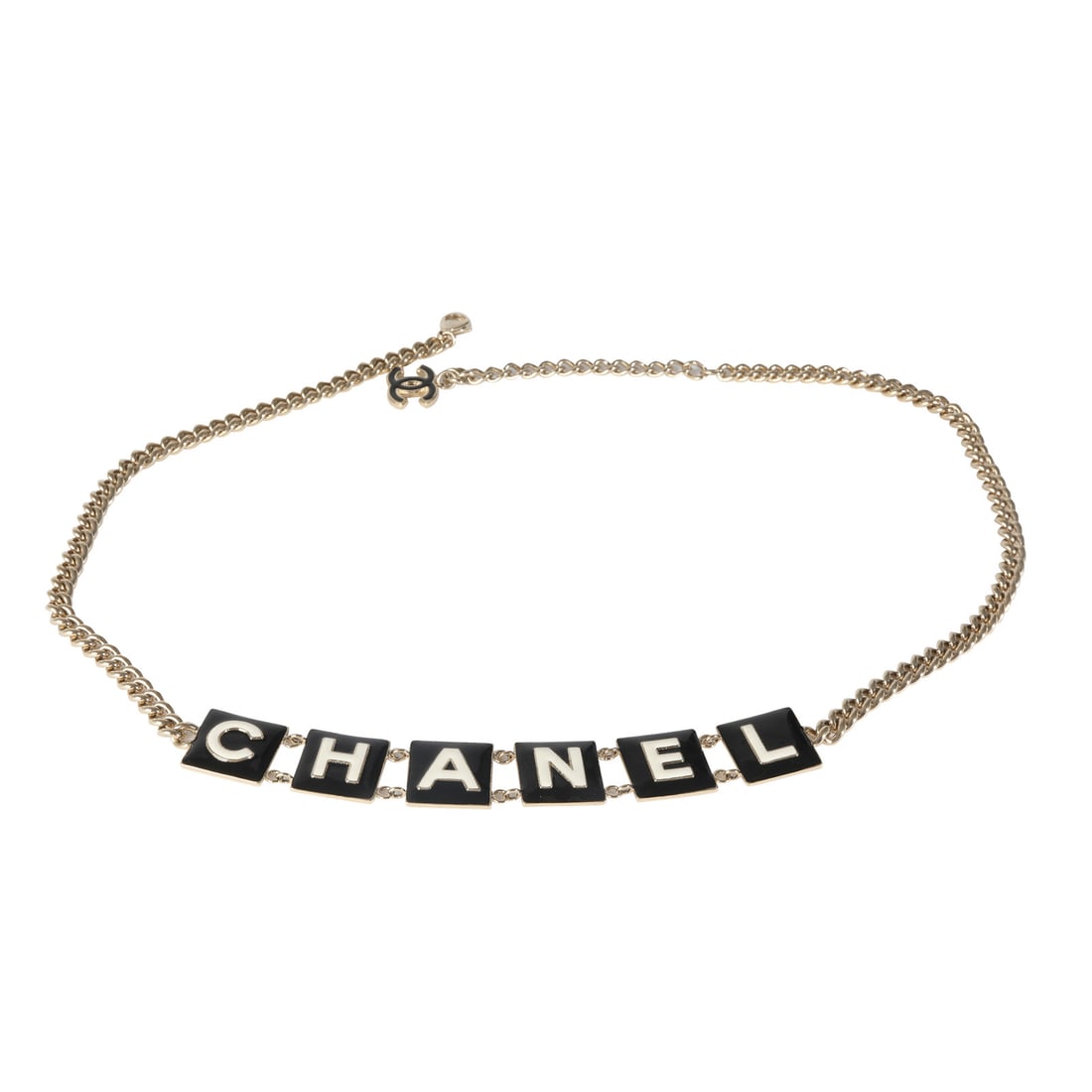 Chanel 2022 Black White Enamel Gold Plated Unisex Belt: Chanel 2022 Black White Enamel Gold Plated Unisex Belt This exquisite Chanel belt from the 2022 collection features a striking black and white enamel design complemented by a luxurious gold plated fin