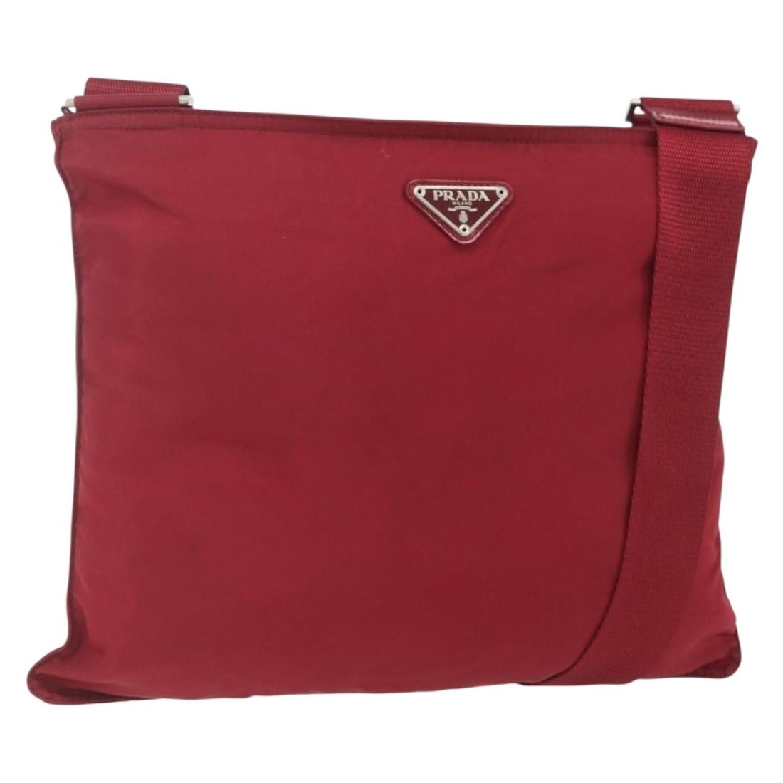 Prada red silver nylon women s shoulder bag Italy: Prada red silver nylon women s shoulder bag Italy This PRADA shoulder bag is crafted from red and silver nylon and features a sleek, modern design. Made in Italy, the bag offers a spacious interior wi