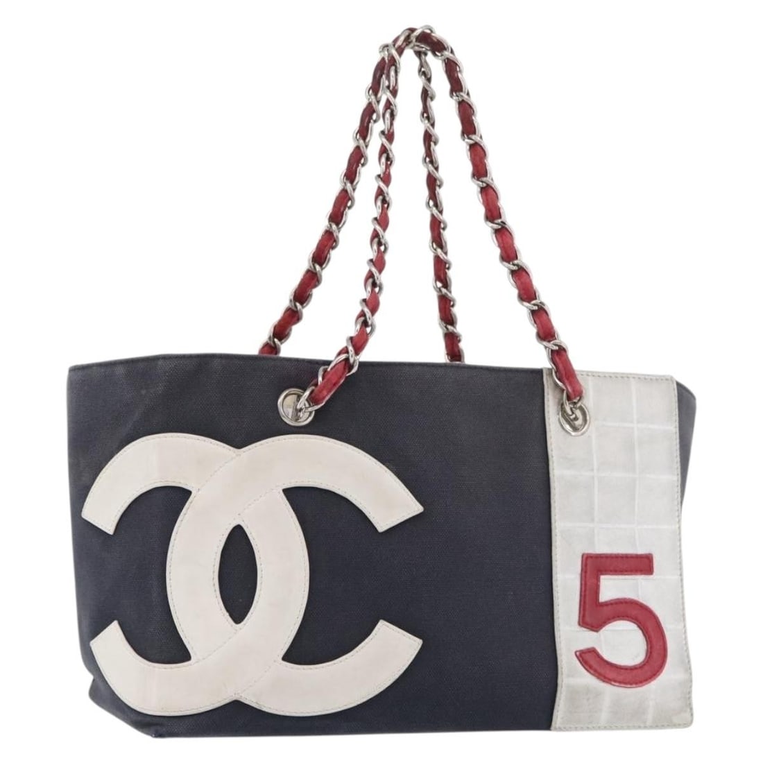 CHANEL No5 Choco Bar Canvas Chain Tote Navy Silver: CHANEL No5 Choco Bar Canvas Chain Tote Navy Silver CHANEL Choco Bar Chain Tote Bag No. 5 in navy and silver canvas, made in Italy. This women's tote bag features a 29 cm width, 19 cm height, 15 cm dep