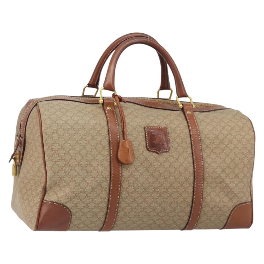 Celine Macadam Boston Bag in Beige PVC Canvas with Padlock and Keys: Celine Macadam Boston Bag in Beige PVC Canvas with Padlock and Keys A CELINE Boston bag in beige and gold, crafted from PVC leather and Macadam canvas. Made in Italy, it comes with a padlock, two keys