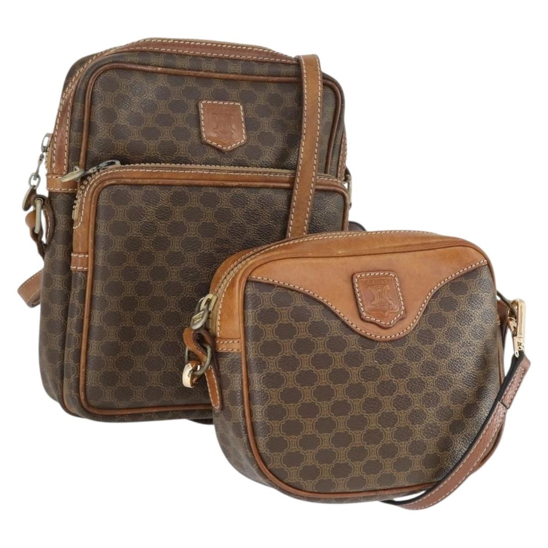 Set of 2 Celine Macadam PVC Brown Shoulder Bags with Replacement Strap: Set of 2 Celine Macadam PVC Brown Shoulder Bags with Replacement Strap This CELINE Macadam Canvas shoulder bag set features brown PVC leather and signature Macadam canvas. The set includes two shoulde