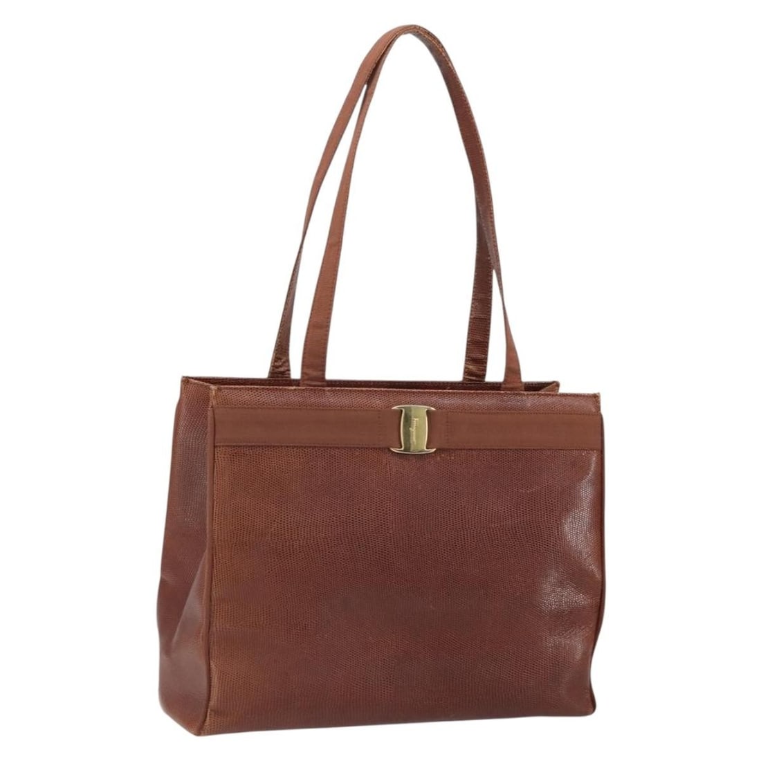 Brown Leather Salvatore Ferragamo Vala Tote Bag Gold Accents Italy: Brown Leather Salvatore Ferragamo Vala Tote Bag Gold Accents Italy This Salvatore Ferragamo Vala tote bag features a brown leather exterior with gold accents. Made in Italy, it offers a spacious inter