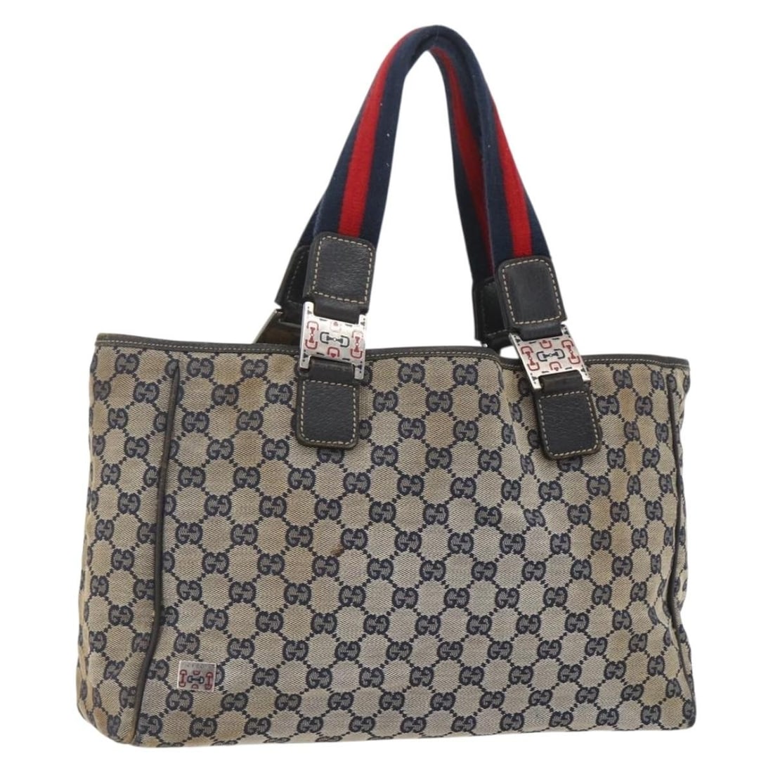 Navy and Red GG Canvas Sherry Line Tote by Gucci: Navy and Red GG Canvas Sherry Line Tote by Gucci This is a Gucci GG Canvas Sherry Line tote bag featuring a navy and red color scheme. Crafted in Italy, the bag is designed for women and made from the