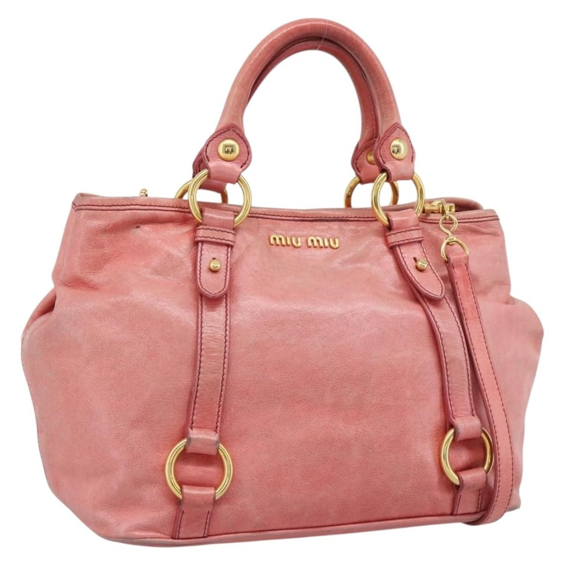 Miu Miu Pink Leather 2way Handbag with Shoulder Strap: Miu Miu Pink Leather 2way Handbag with Shoulder Strap Miu Miu 2-way leather hand bag in pink with gold-tone details. Made in Italy, it comes with a shoulder strap and features a structured size of app