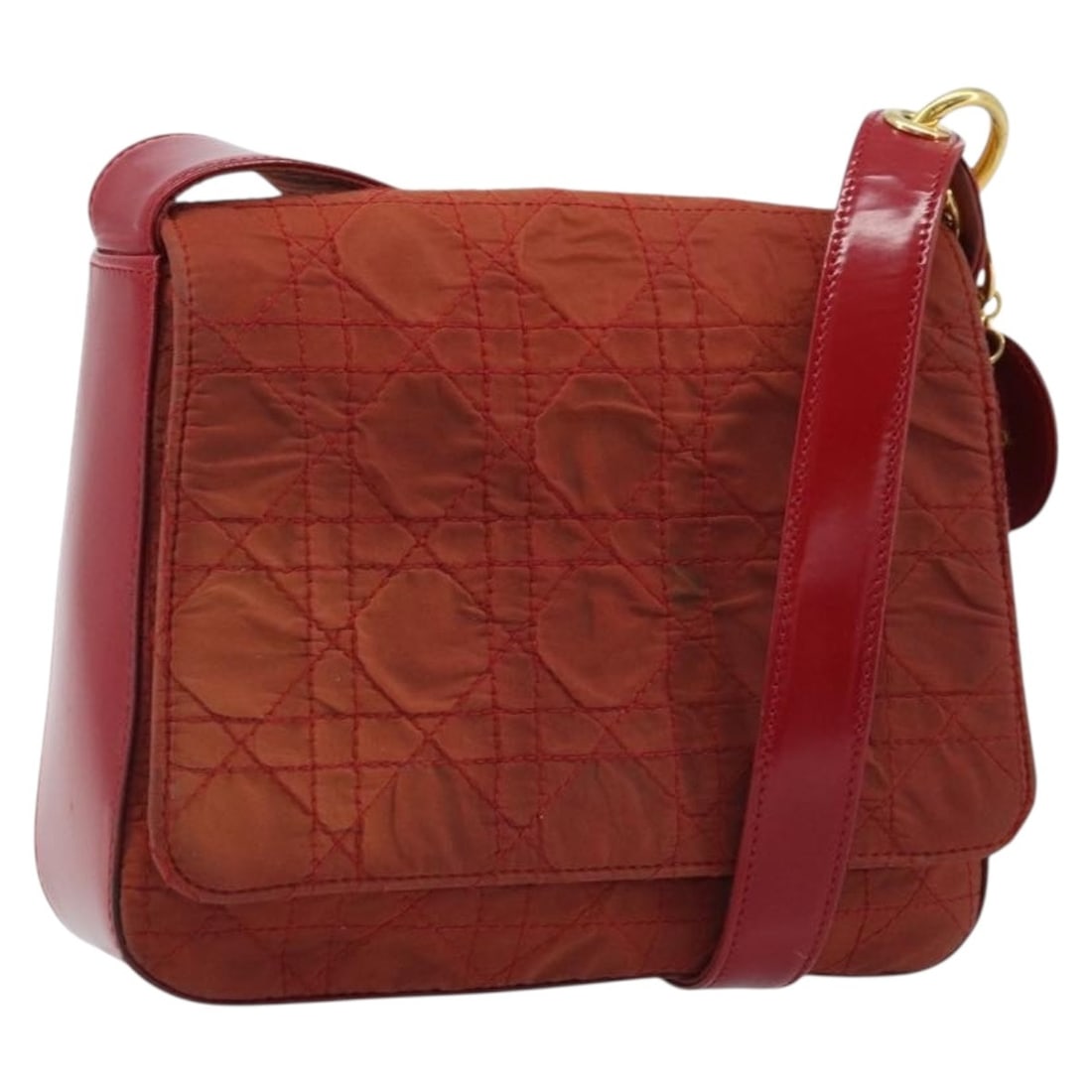 Red Nylon Cannage Shoulder Bag by Christian Dior with Gold Tone Charm: Red Nylon Cannage Shoulder Bag by Christian Dior with Gold Tone Charm This Christian Dior Canage shoulder bag features a red and gold nylon exterior and includes a decorative charm. Designed for women