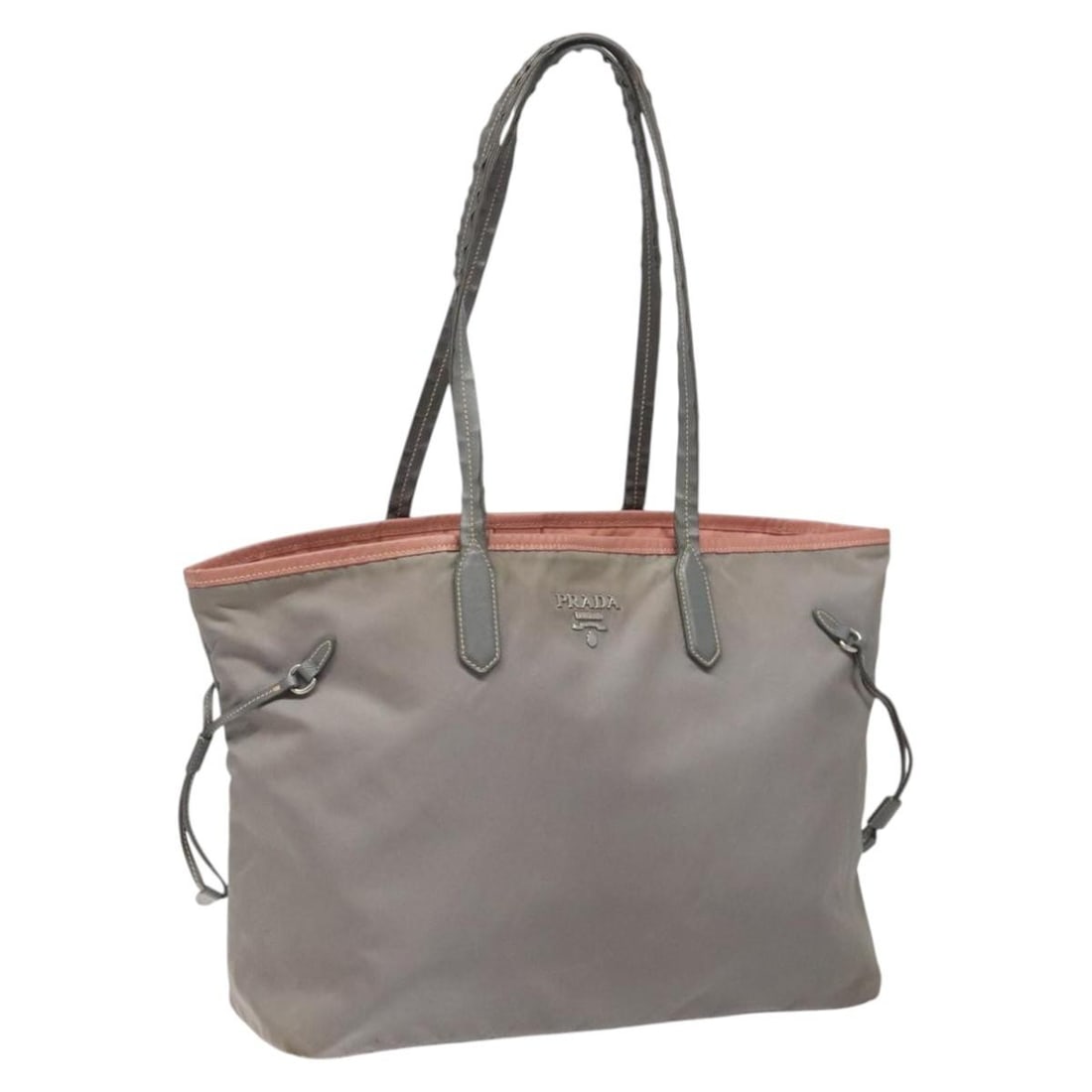 Prada Gray Nylon Women's Tote Bag Made in Italy: Prada Gray Nylon Women's Tote Bag Made in Italy This PRADA tote bag is crafted from gray nylon and designed for women. It features a spacious interior and classic tote silhouette. The bag shows signs 