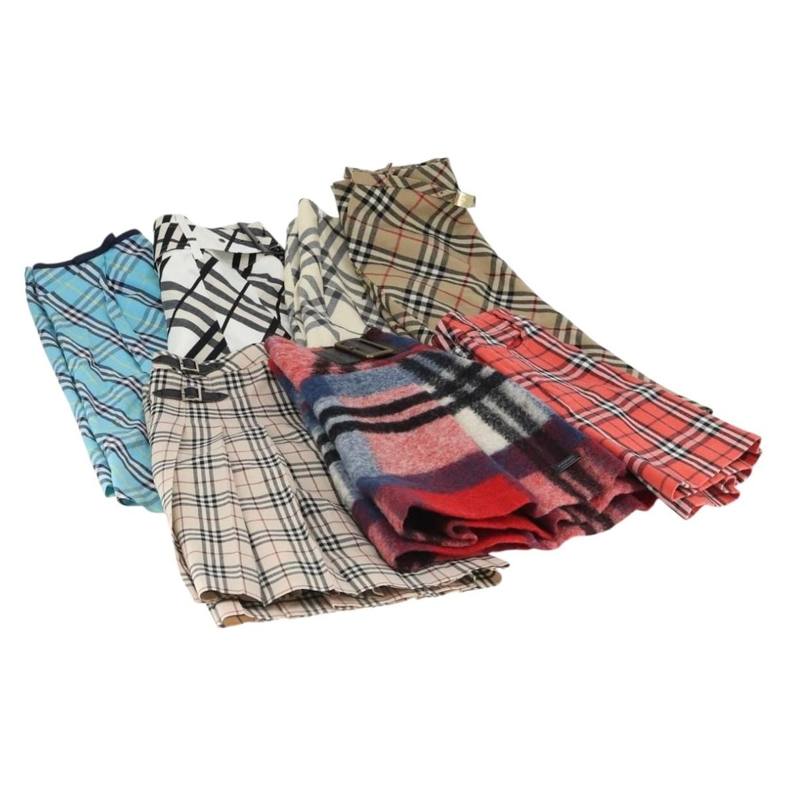 Set of 7 Cotton Burberry Nova Check Skirts in Beige Red Blue: Set of 7 Cotton Burberry Nova Check Skirts in Beige Red Blue This Burberry Nova Check skirt is made of cotton featuring the brand's iconic beige, red, and blue check pattern. It is a part of a 7-piece