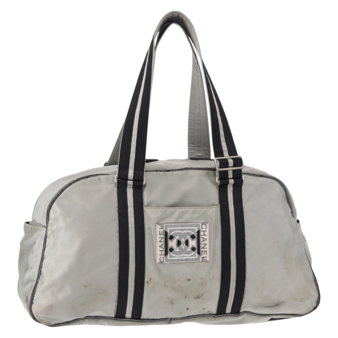CHANEL Sports Line Nylon Boston Bag Silver with Guarantee Card: CHANEL Sports Line Nylon Boston Bag Silver with Guarantee Card CHANEL Sports Line Boston Bag in silver nylon, made in Italy. This Boston-style bag comes with a guarantee card and has a serial number 1