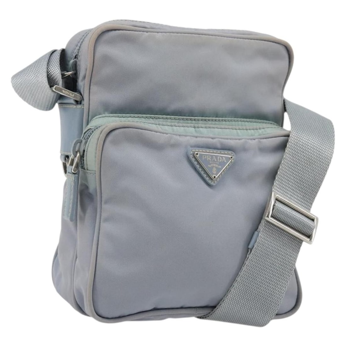 PRADA Nylon Shoulder Bag Light Blue Silver with Guarantee Card: PRADA Nylon Shoulder Bag Light Blue Silver with Guarantee Card Prada shoulder bag in light blue nylon with silver-tone accents. Made in Italy, this women's bag includes the guarantee card. Condition i