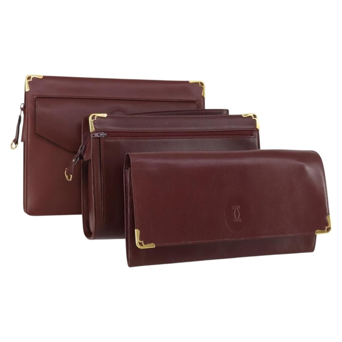 CARTIER Bordeaux Leather Clutch Bag 3 Piece Set Authentic: CARTIER Bordeaux Leather Clutch Bag 3 Piece Set Authentic This elegant CARTIER clutch bag set is crafted from luxurious leather in a rich Bordeaux hue. Ideal for any occasion, this stylish accessory s