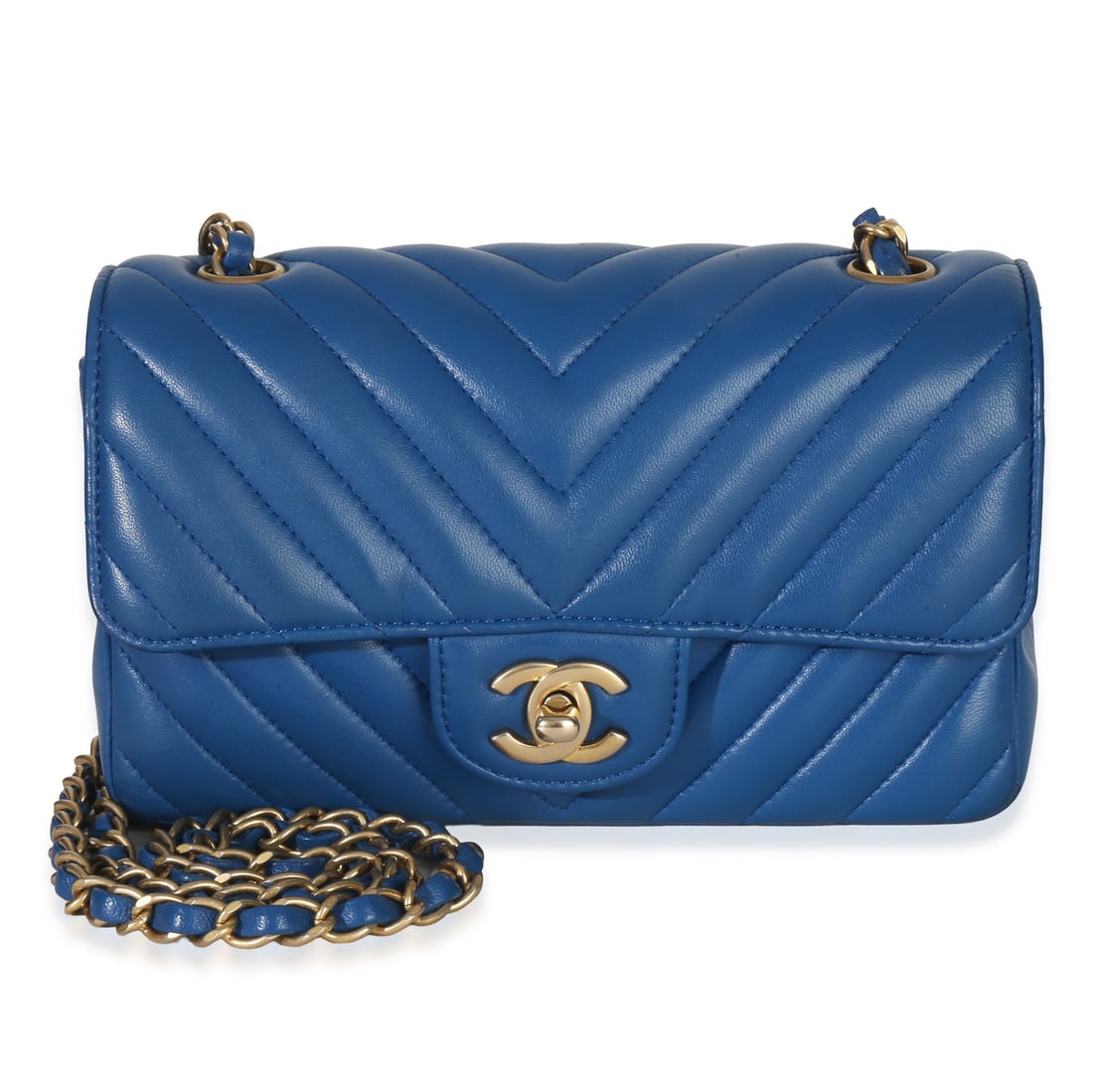 Chanel Mini Flap Blue Lambskin Chevron Shoulder Bag 22 in Strap: Chanel Mini Flap Blue Lambskin Chevron Shoulder Bag 22 in Strap This Chanel Blue Lambskin Chevron Mini Rectangular Flap Bag is crafted from luxurious leather and features a chevron quilted design. The