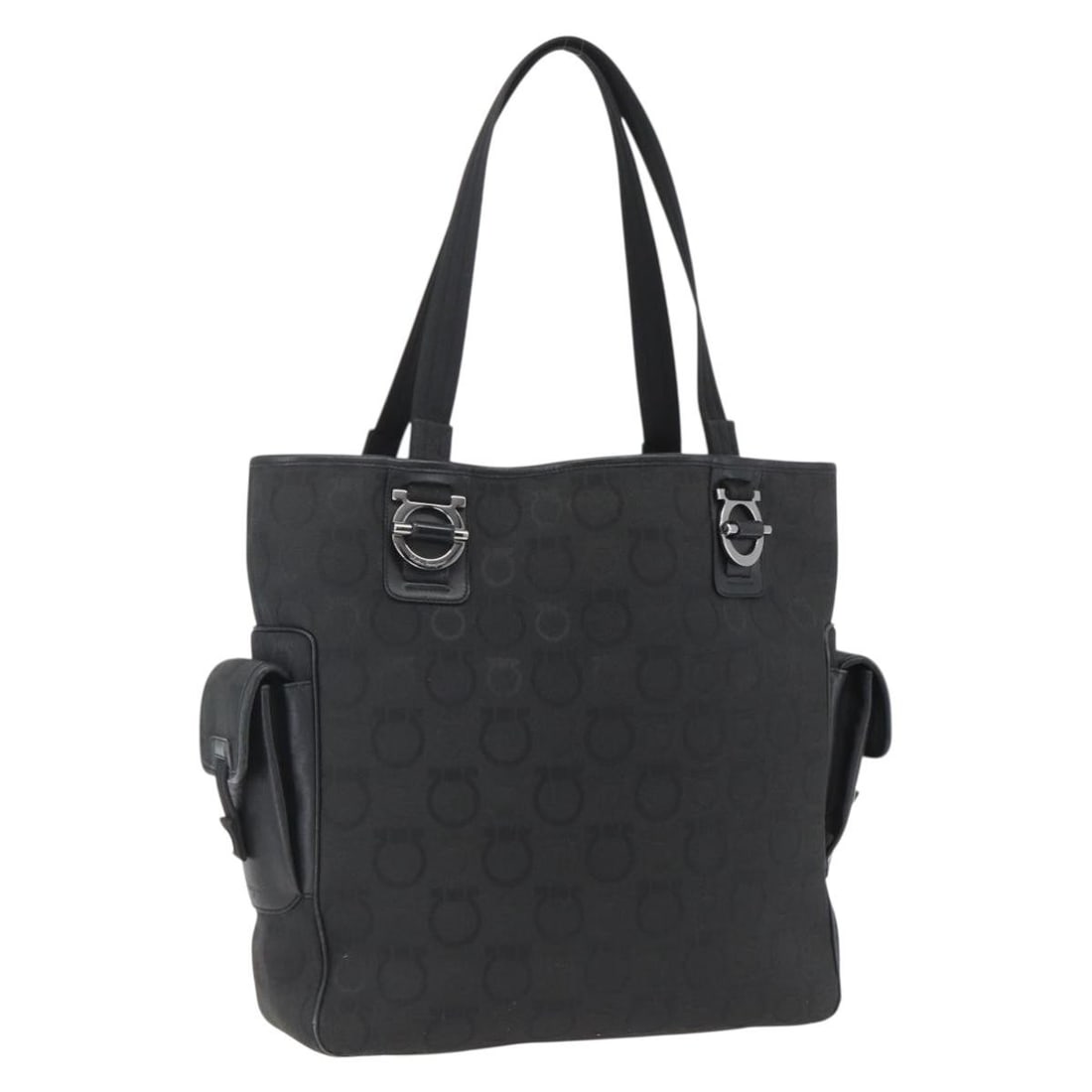 Black and Silver Canvas Tote by Salvatore Ferragamo Italy: Black and Silver Canvas Tote by Salvatore Ferragamo Italy This Salvatore Ferragamo tote bag features a black and silver canvas exterior. Designed for women, it offers a spacious interior and is crafte