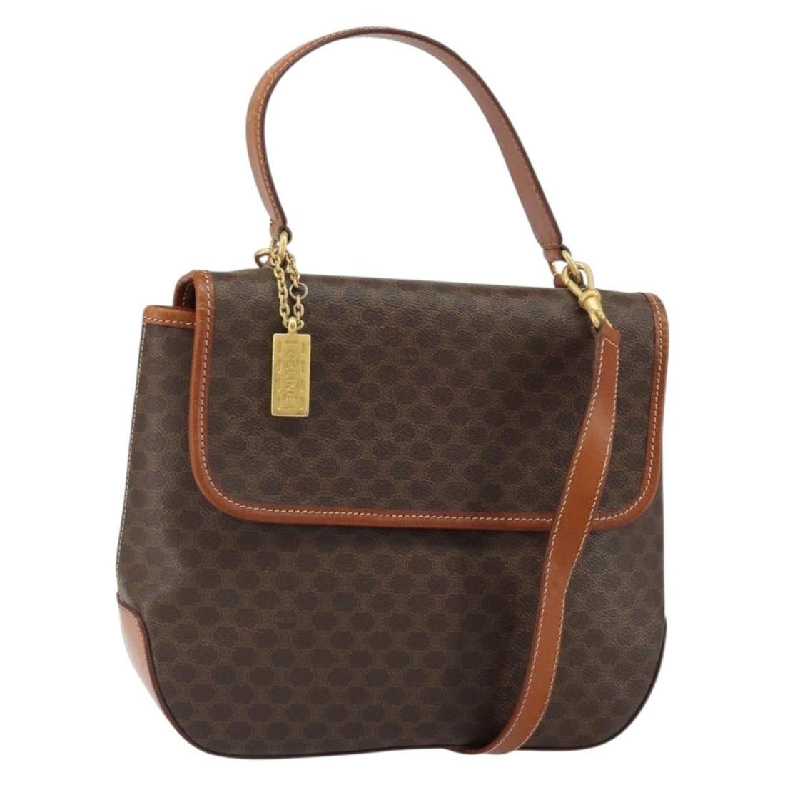 Celine Macadam Brown PVC Canvas Handbag with Shoulder Strap Gold Accents: Celine Macadam Brown PVC Canvas Handbag with Shoulder Strap Gold Accents This CELINE Macadam Canvas hand bag features a two-way design with both handles and a detachable shoulder strap. Crafted from P