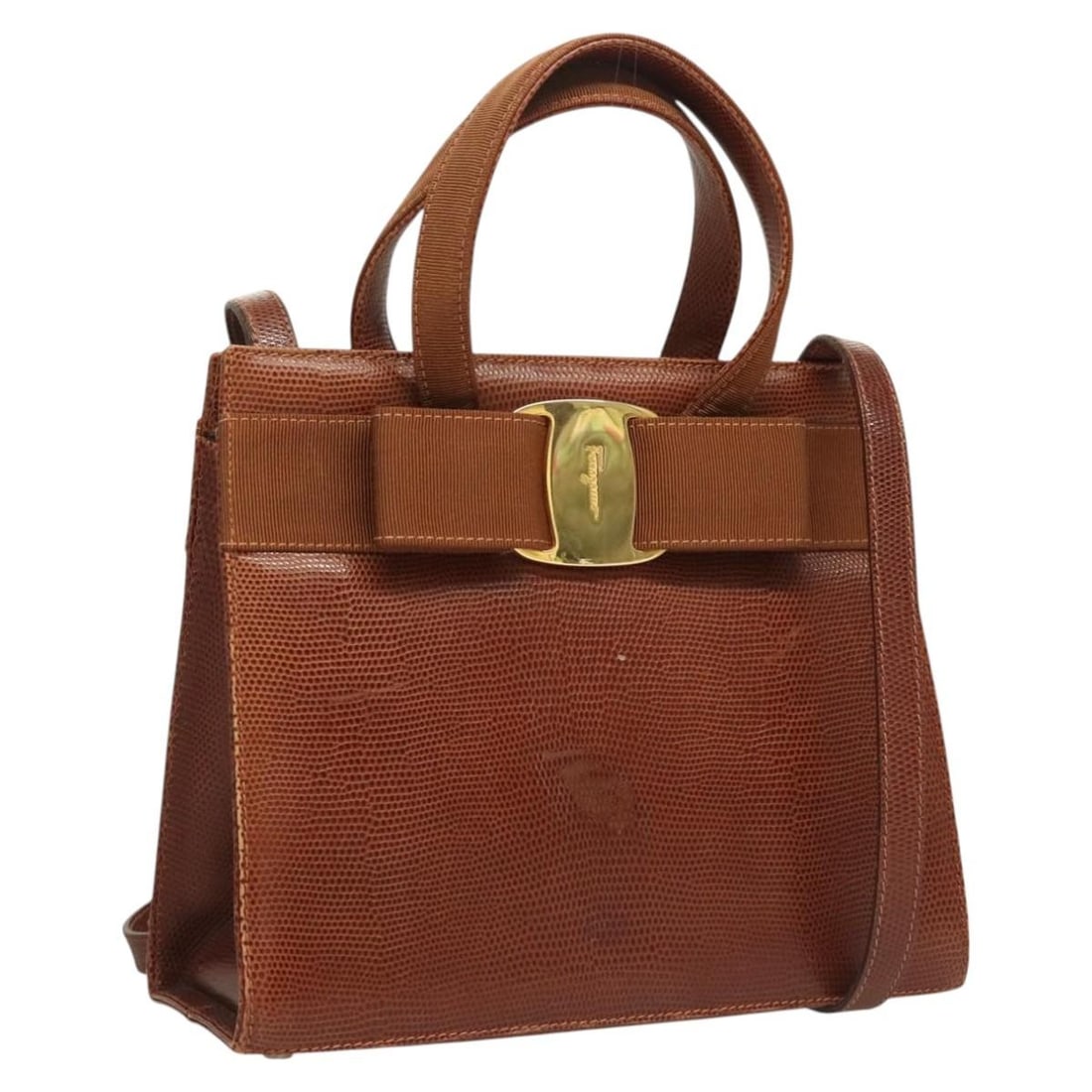 Ferragamo Vala Brown Gold Leather 2way Handbag Shoulder Strap: Ferragamo Vala Brown Gold Leather 2way Handbag Shoulder Strap This Salvatore Ferragamo Vala handbag is crafted from embossed leather in a brown and gold color scheme. Designed for versatility, it can 