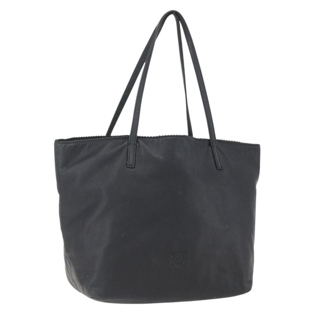 LOEWE Black Leather Tote Bag Made in Spain: LOEWE Black Leather Tote Bag Made in Spain A black leather tote bag from LOEWE, made in Spain. It features a structured tote style with a handle drop of approximately 22 cm. The bag is offered in heav