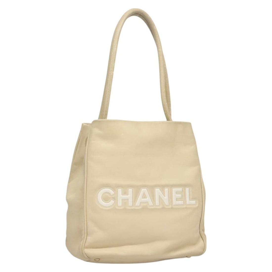 CHANEL Camelia Beige Leather Tote Handbag CC France: CHANEL Camelia Beige Leather Tote Handbag CC France CHANEL beige leather tote bag for women, made in France. The bag measures approximately 23 cm W x 24 cm H x 10 cm D, with a handle drop of approxima