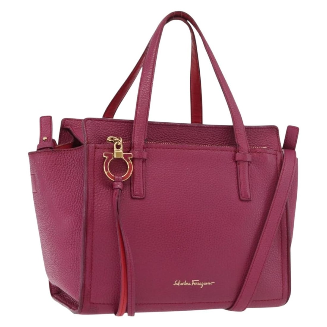 Purple Gold Leather Gancini Shoulder Bag by Salvatore Ferragamo: Purple Gold Leather Gancini Shoulder Bag by Salvatore Ferragamo This Salvatore Ferragamo Gancini handbag is crafted from leather in a striking purple and gold color combination. Designed for versatili