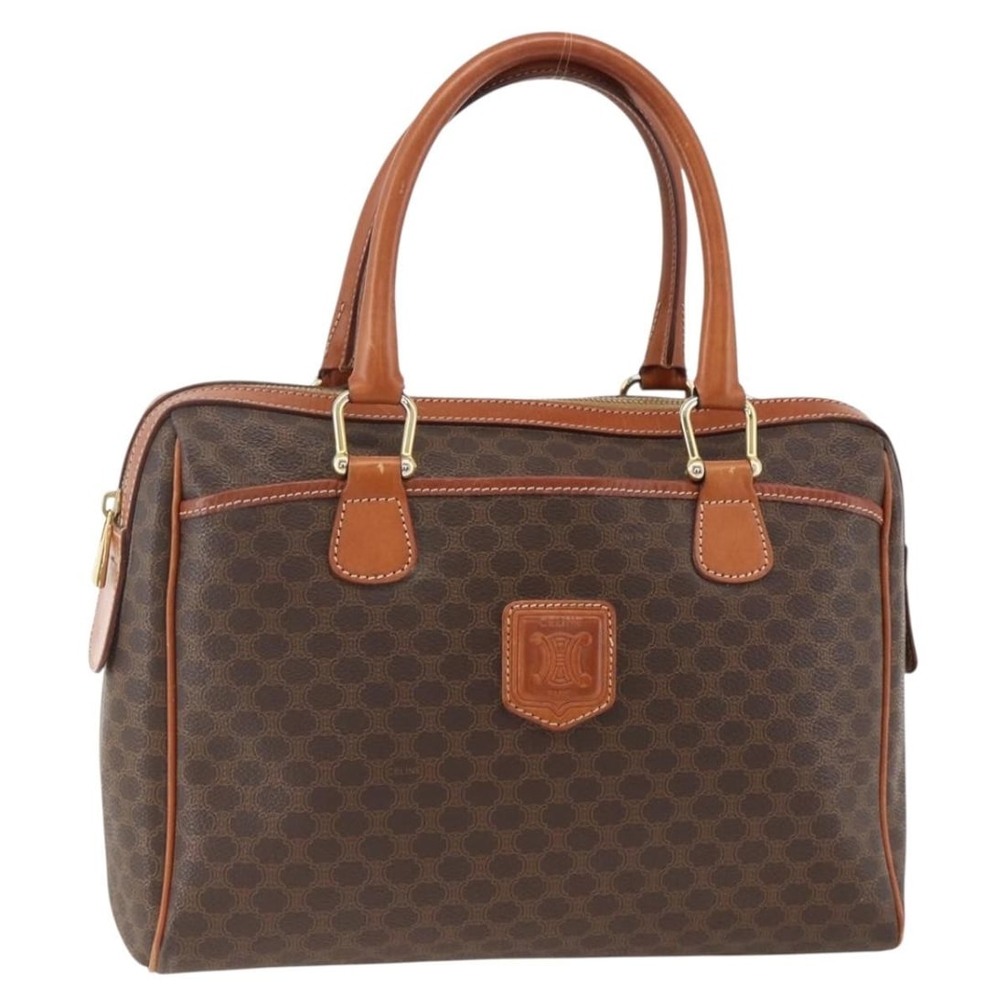 Celine Macadam Brown PVC Canvas Handbag with Leather Trim Gold Accents: Celine Macadam Brown PVC Canvas Handbag with Leather Trim Gold Accents This CELINE Macadam Canvas hand bag features a classic brown and gold design crafted from PVC leather and Macadam canvas. The