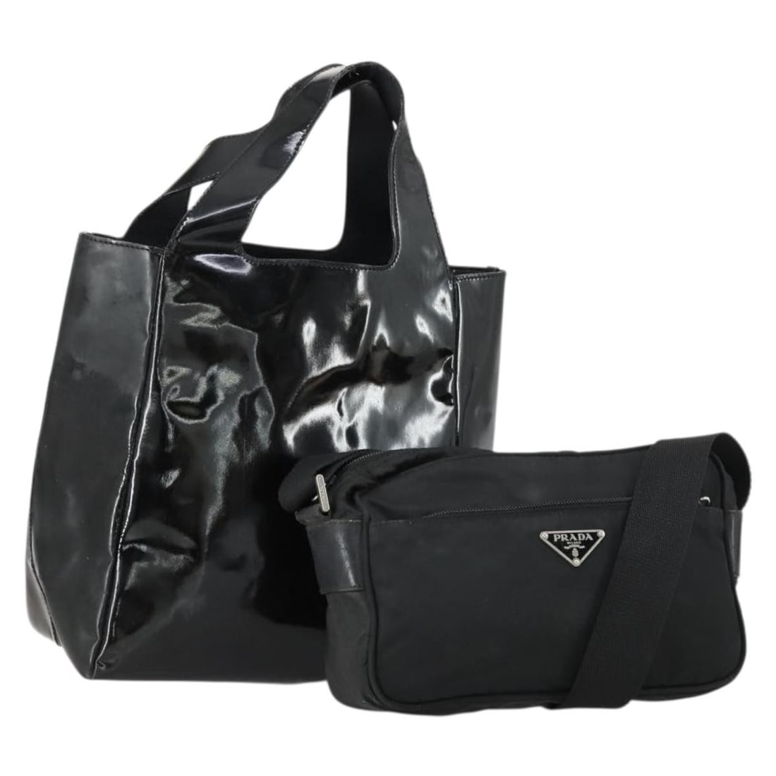 Black Nylon Shoulder Bag 2 Piece Set PRADA Enamel: Black Nylon Shoulder Bag 2 Piece Set PRADA Enamel Black PRADA shoulder bag set in nylon with enamel detailing, made in Italy. Includes a guarantee card. The bag shows heavy use with deformation, rubbi