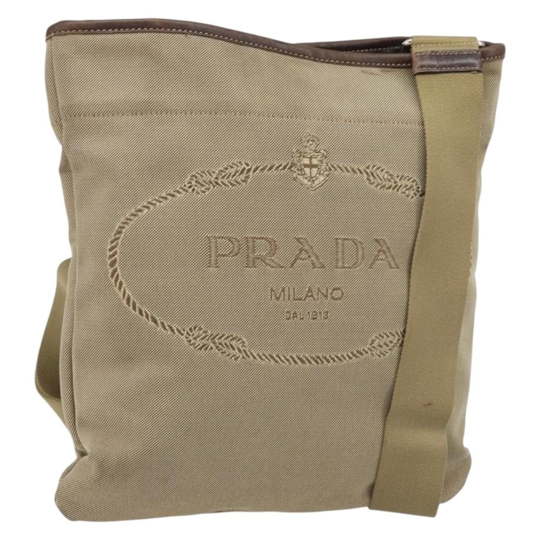 PRADA Beige Silver Canvas Shoulder Bag with Guarantee Card: PRADA Beige Silver Canvas Shoulder Bag with Guarantee Card Authentic Prada shoulder bag in beige and silver canvas with an adjustable shoulder strap. Made in Italy, this women's bag includes the guara